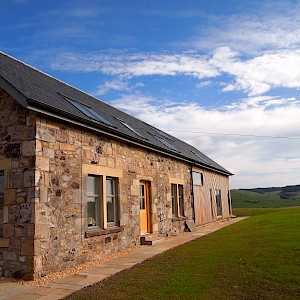 Extensive repairs to stone cottage and erection of contemporary side extension at Collairnie